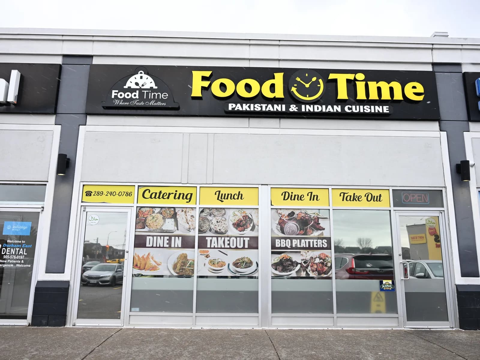 Food Time Whitby storefront — black & yellow signage