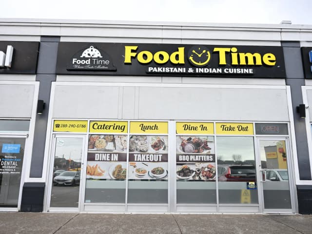 Food Time Whitby storefront — black & yellow signage